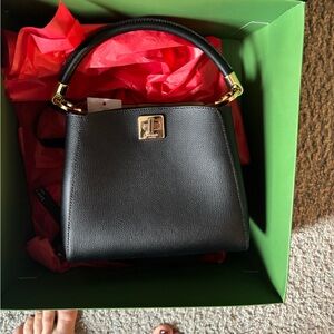 Kate Spade Black Leather Shoulder Bag with Gold Accents